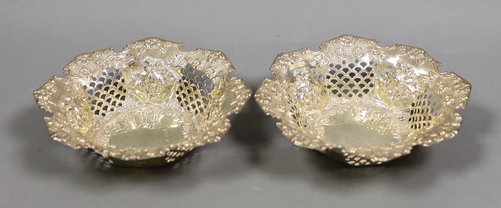 A pair of late Victorian pierced silver bonbon dishes, William Hutton & Sons, Birmingham, 1899, diameter 15.9cm, 7.1oz.